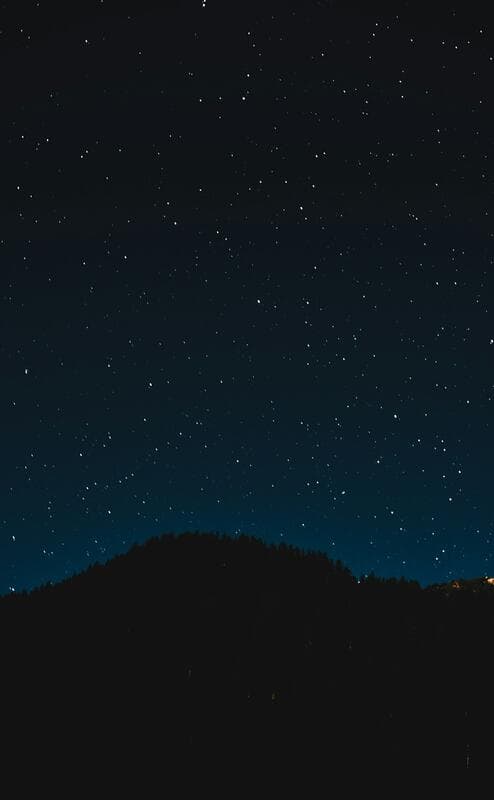 Golden sunrise over mountains symbolizing new beginnings and the manifestation power of angel number 111